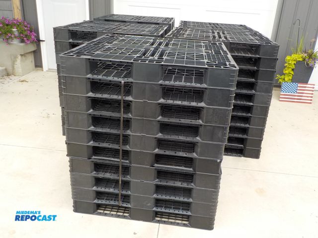 Lot 2-33536 - Lot of (50) plastic 4-way pallets.  43 1/2 in x 43 1/2 in. Few chips and cracks. National Pallet Com...