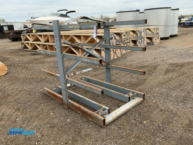 Lot 2-34458 - Metal Two Sided Cantilever Rack, on wheels so it can roll sideways (wheels are missing outer coating...