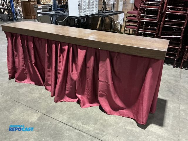 Lot 2-55164 - (1) wooden table with dual pedestal legs 78.5“ x 18“ with front table skirt  (RSSC)