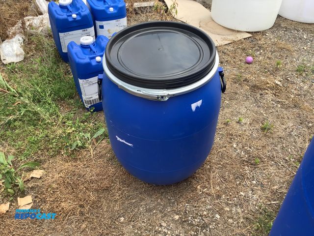 Lot 2-64406 - 25 gallon blue plastic barrel with removable lid and locking ring, clean inside, contained a food pr...