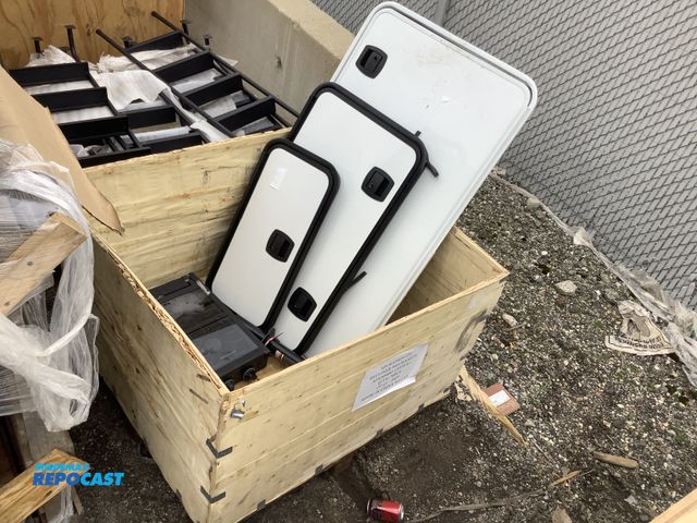 Lot 2-93682 - Crate w/ misc. RV Cargo Doors &amp; Power Jack Tongue