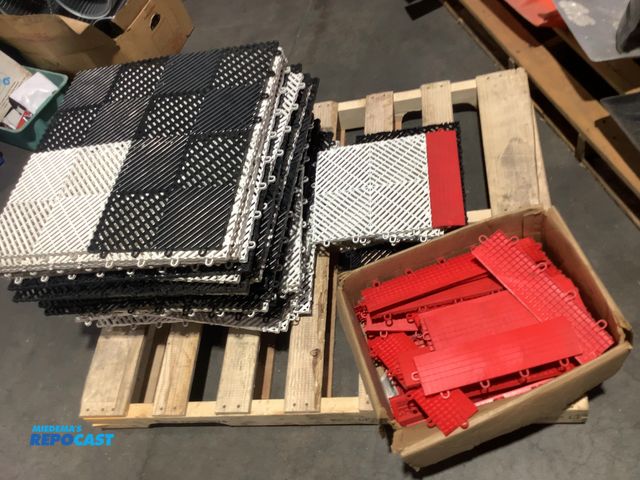 Lot 2-79305 - Stack of black and white interlocking drainage tiles and red edging pieces