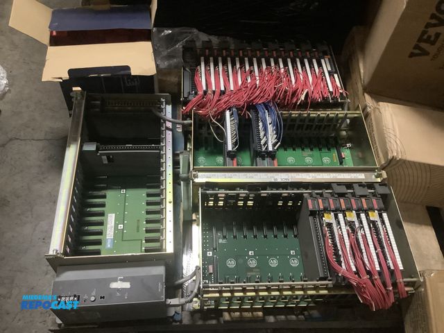 Lot 2-10330 - Skid lot of Allen Bradley 16-slot I/O Chassis’ and mini plastic storage bins