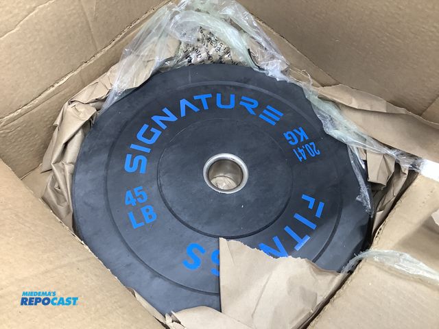 Lot 2-35771 - Signature Fitness 45lb weight plate, new in box