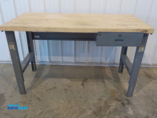 Lot 2-34207 - Industrial Global work station. Wood top. One drawer. Adjustable legs. 60" w x 30" d x 37" h