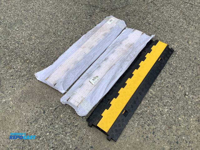 Lot 2-35020 - Lot of (3) rubber cable protectors measuring 39” long.