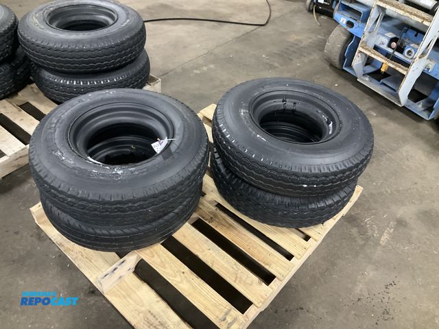 Lot 2-33502 - (4) 8-14.5 tires on steel mobile home style wheels, used