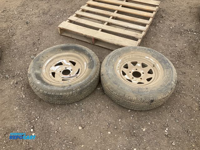 Lot 2-43273 - (2) 205/75R15 trailer tires on steel 5 bolt wheels, used, one is flat