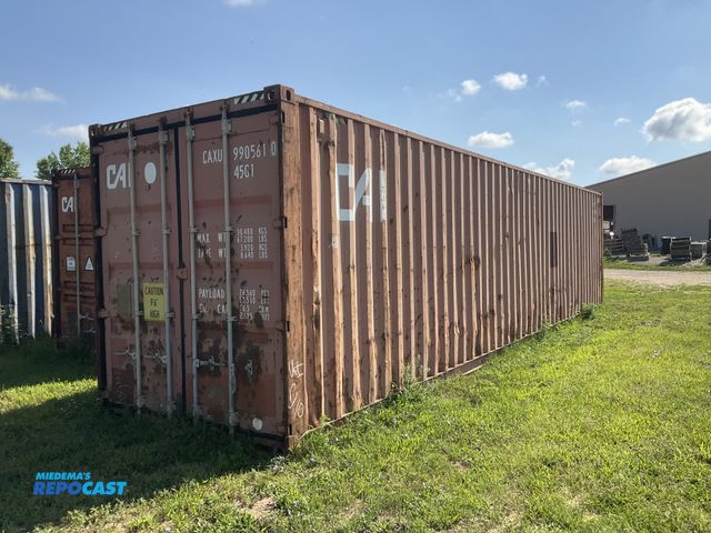 Lot 2-21178 - 40’ High Cube Shipping/ Storage Container, 9’ 6” T x 8’ W, swing doors on one end, wood deck, tie do...