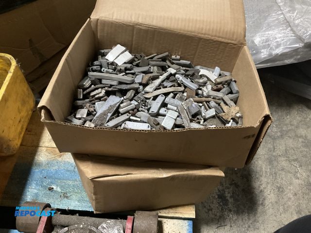 Lot 2-23024 - (2) boxes filled with what appears to be mixed scrap automotive wheel weights