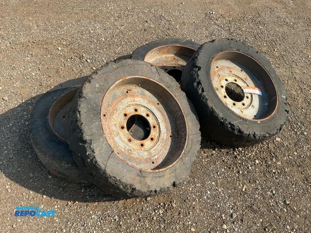 Lot 2-40349 - (4) Used 33x6x8 Solid Rubber Skid Steer Tires and Wheels, 8 on 8" bolt pattern
