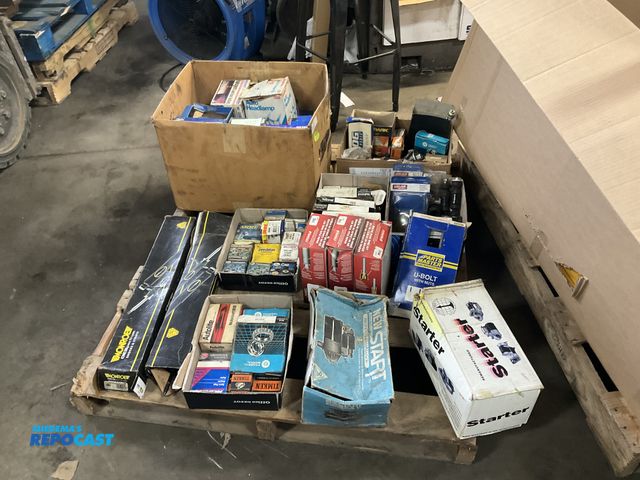 Lot 2-94812 - Skid lot of New Old Stock Auto Parts including: Starter Motors, Spark Plug Wire Sets, Shocks, Spark ...