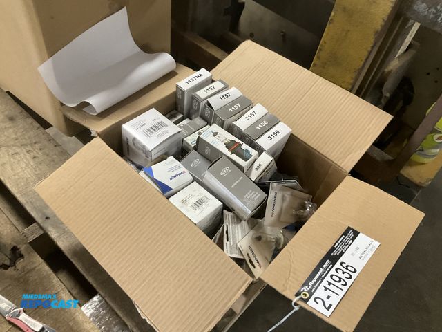 Lot 2-11936 - Box of new headlight bulbs and other misc lights, see pictures for part numbers and approx quantitie...
