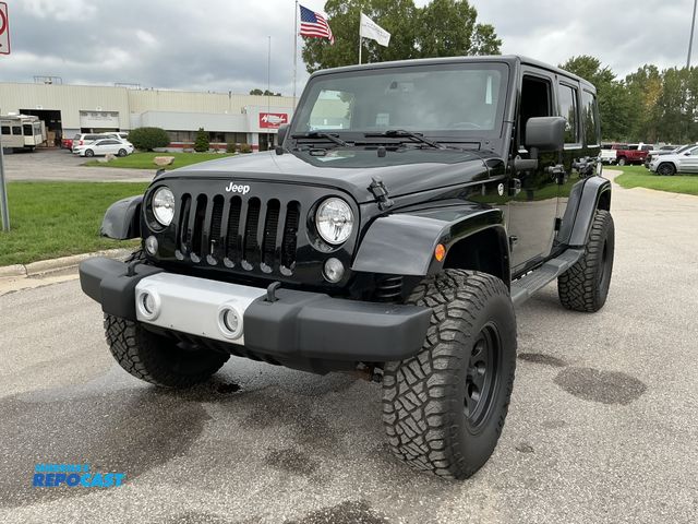 Lot 2-27024 - 2014 Jeep Wrangler Unlimited Sahara 4WD SUV