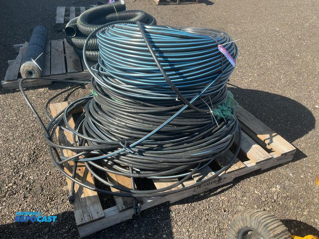 Lot 2-20034 - Skid full of poly drip tubing, has holes every so often to water plants, approx. 3/4” outside diamet...