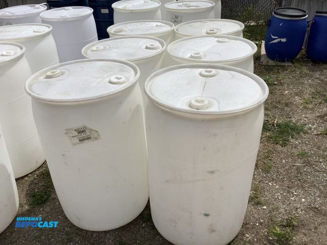 Lot 2-15590 - lot of 6 55 gallon white plastic barrels with 2 removable bungs, contained mineral oil