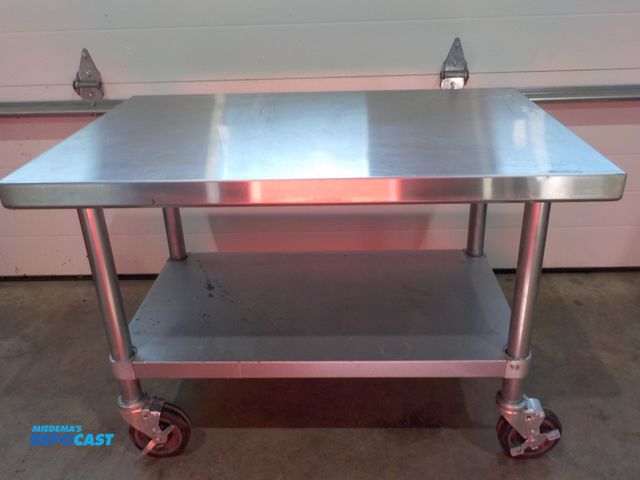 Lot 2-34107 - Stainless steel table/cart. Locking castors. Bottom shelf. 36" w x 24" d x 25" h