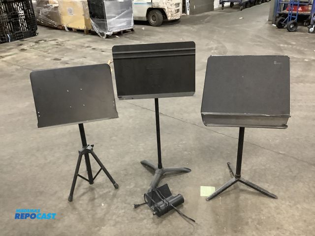 Lot 2-93658 - Lot of three musical stands, one Manhasset metal stand, a Wenger plastic stand, and a on stage metal...