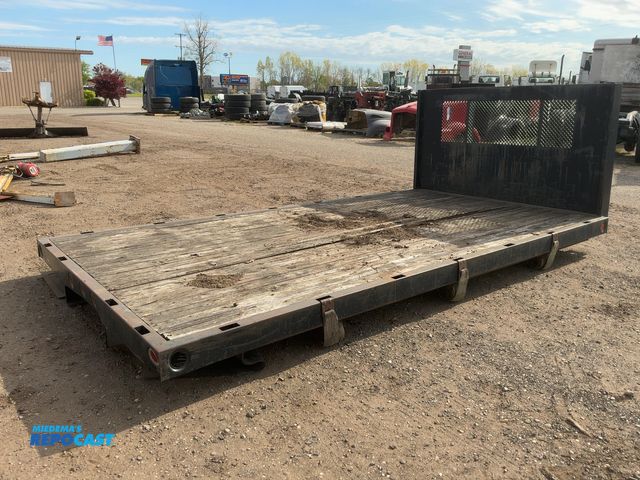 Lot 2-11697 - 14’10” Long Steel Flatbed, 96” Wide, 4’ tall metal bulkhead, stake pockets, wood deck, (3) rail slid...