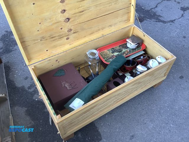 Lot 2-94949 - Wooden 43”x22”x17”H blanket trunk with various home decor inckuding moose signs, tissue cover, jars,...