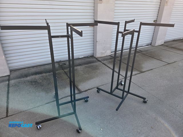 Lot 2-33444 - 2 adjustable metal clothing racks, fixtures
