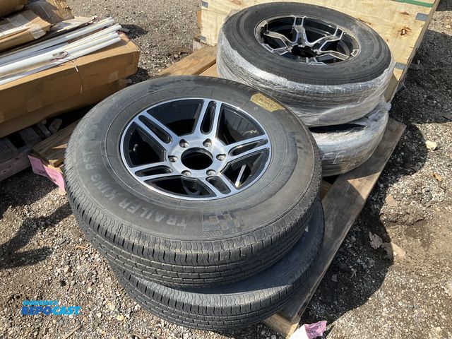 Lot 2-94912 - Skid lot of (4) tires with rims including (2) trailer king RST ST225/75R15 and castle rock ST radial...