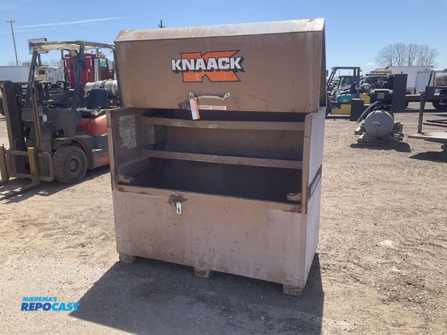 Lot 2-43466 - Knaack storage box with flip top, 60.5”W x 30” x 49.5”T overall, scattered dents, lift struts are da...
