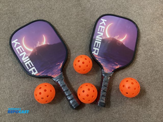 Lot 2-79395 - New Kenier Pickleball set. Includes 2 paddles and four balls in carrying case.