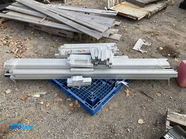 Lot 2-69443 - aluminum channel 80-20/aluminum framing sections with hinges, seals, and wiring.