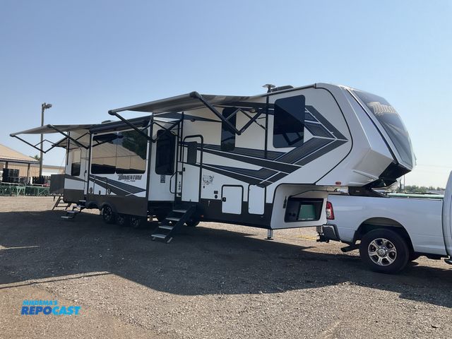 Lot 2-20805 - 2018 Momentum 395M Toy Hauler 5th Wheel Trailer