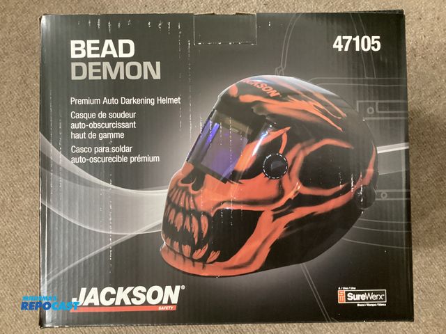 Lot 2-67317 - New BEAD DEMON Premium Auto Darkening Welding Helmet. By JACKSON. Red and Black