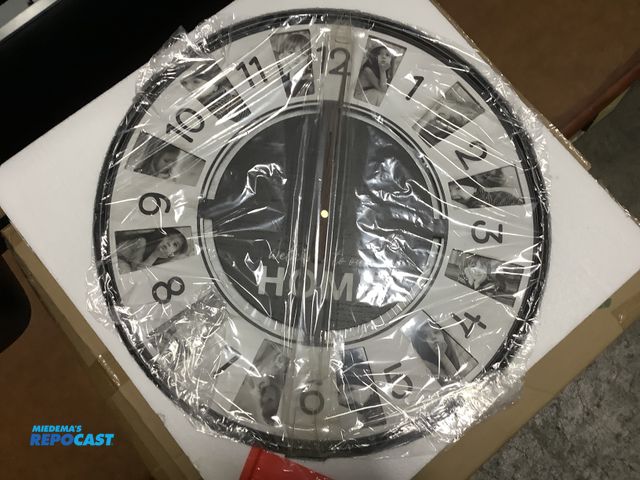 Lot 2-32677 - Lot of (1) a family picture clock with picture frame for each number saying welcome to our home on b...