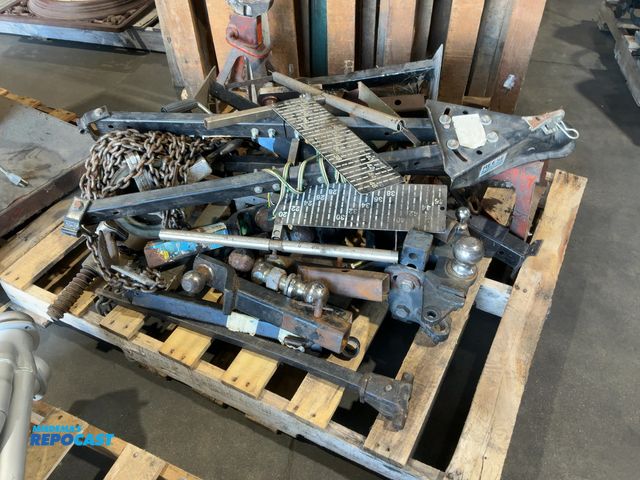 Lot 2-92719 - Skid of assorted hitches, chain hoists, jacks, &amp; jack stands.