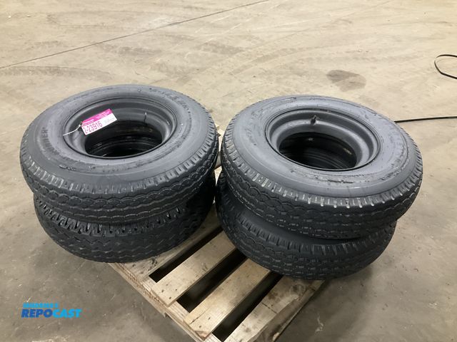 Lot 2-23916 - (4) 8-14.5 tires on steel mobile home style wheels, used