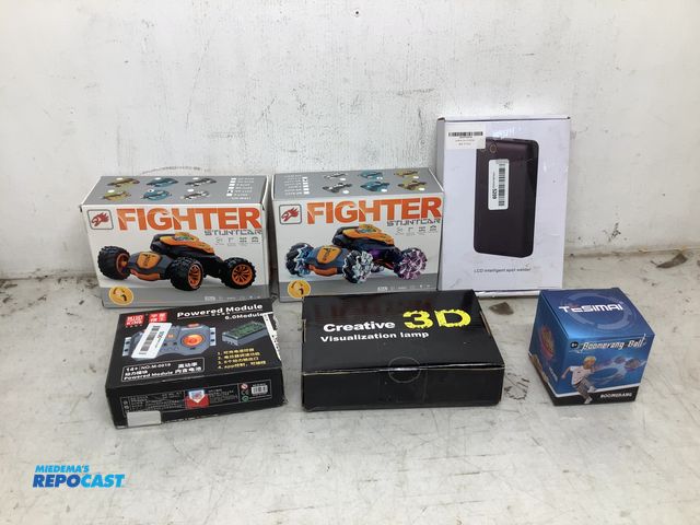 Lot 2-75101 - (2) fighter 2377-2A stunt cars, a LCD intelligent spot welder, a Mould king powered 6.0 module, a cr...