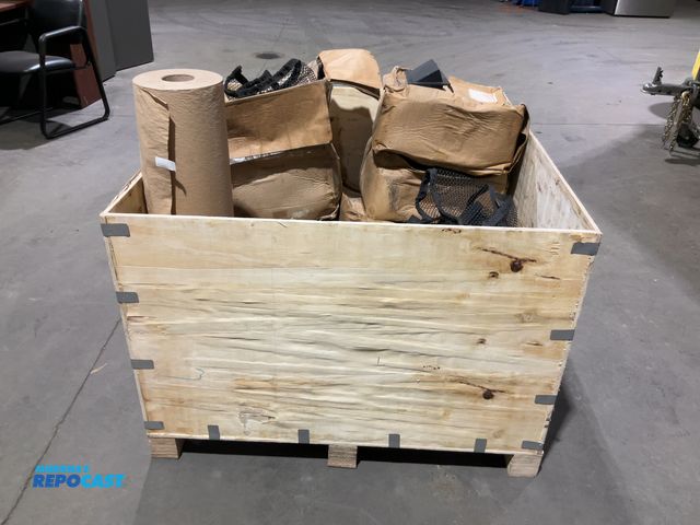 Lot 2-15217 - Crate of RV Accessories Including: 8 Boxes of Mesh Cargo Nets, Roll of Paper Floor Covering and a Pl...