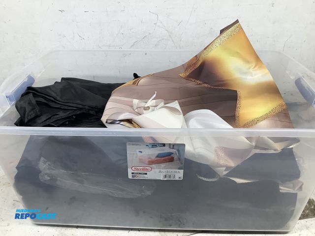 Lot 2-27665 - Bin of miscellaneous stuff including flags/banners, table cloths and more