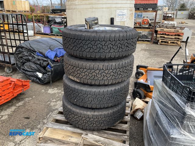 Lot 2-94899 - Skid lot of (4) wrangle Goodyear LT275/65R20 Chevy truck tries with rims and west coast wheel access...