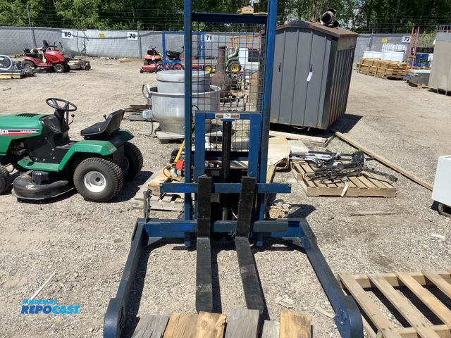 Lot 2-75447 - Vestil Pallet Jack/Stacker. 12v on board charger, new battery. 4000lb lift capacity. 8" oversized ca...