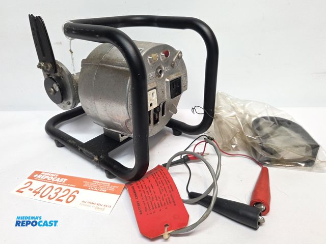Lot 2-40326 - Chainsaw-powered 12v/115v portable generator/alternator.  said to never have been used. Tested, work...