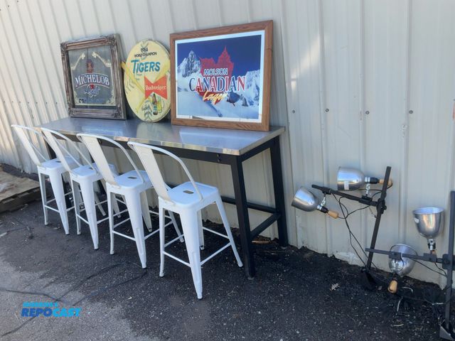 Lot 2-95978 - 8’ Stainless Bar Counter, 4 White Bar Stools, 3 Vintage Bar Signs, and 2 Overhead Bar Signs