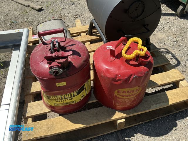 Lot 2-76973 - Lot of (2) red metal gas cans