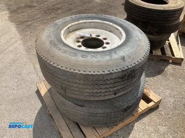Lot 2-11087 - (2) 385/65R22.5 tires on steel wheels, used
