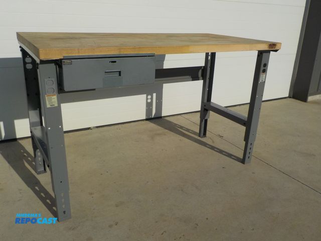 Lot 2-34103 - Industrial Global wood top work station. One drawer. Adjustable legs. 60 in l . 30 in d. 36 in h.