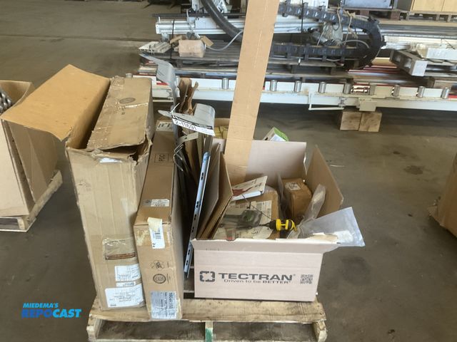 Lot 2-11691 - Skid of misc truck parts including headlights, gaskets, mirror assemblies, trim panel, dipsticks, an...