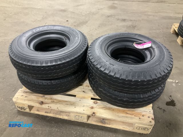 Lot 2-23914 - (4) 8-14.5 tires on steel mobile home style wheels, used