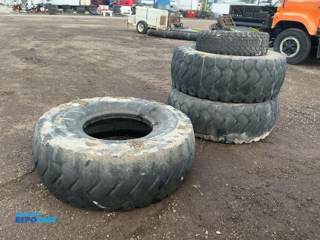 Lot 2-40715 - (3) Used 20.5R25 Loader Tires and (1) BFGoodrich 315/75R16 Tire, tires are in rough shape with low t...