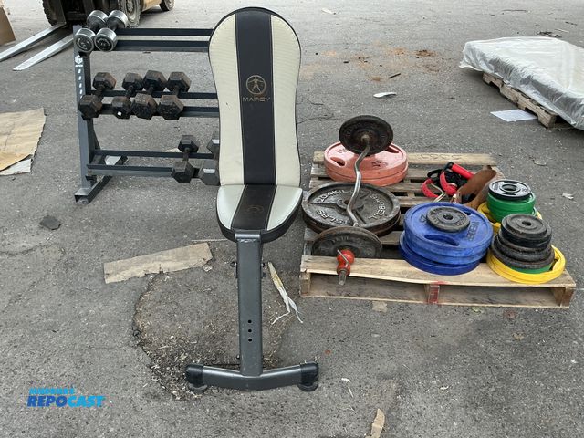 Lot 2-96569 - Marcy adjustable Bench Press, a Rack of various Weights, and a skid of various Weights and other wor...