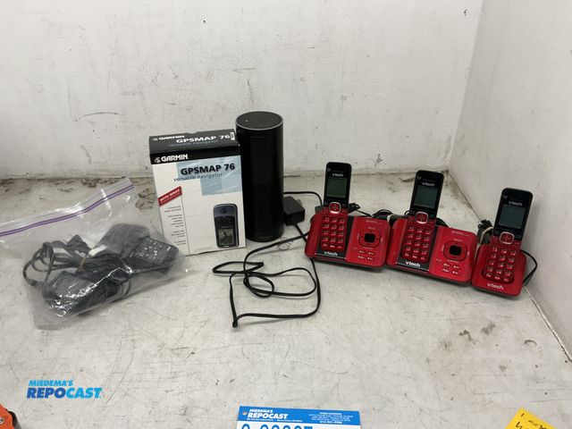 Lot 2-93367 - Lot of Nikon CoolpixS560 Camera, Amazon Alexa, Garmin GPS Map76, vtech Phone System