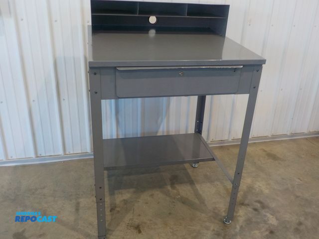 Lot 2-34212 - Industrial personal work station. One pull out drawer. Upper cubbies. Bottom shelf. Adjustable feet....